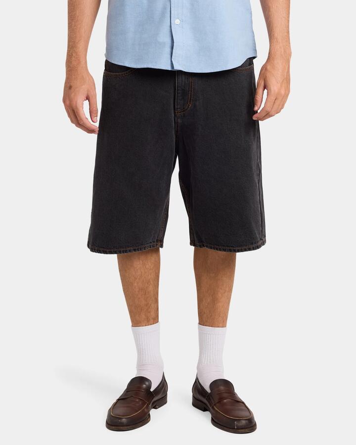 Image of a model wearing Shorts. Productname: RVCA Mens Skate Denim Shorts Black Rinse - in Black Rinse colour by brand - RVCA