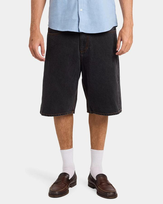 Image of a model wearing Shorts. Productname: RVCA Mens Skate Denim Shorts Black Rinse - in Black Rinse colour by brand - RVCA