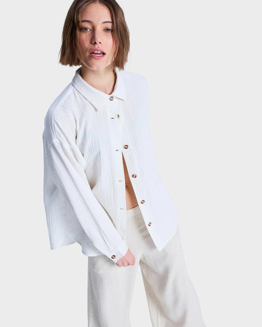Image of a model wearing Tops. Productname: Roxy Womens Morning Shinte Stripe Long Sleeve Shirt Coconut Milk - in Coconut Milk colour by brand - Roxy