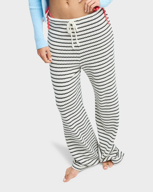 Image of a model wearing Pants. Productname: Roxy Womens Palma De Playa Pants Coconut Milk - in Coconut Milk colour by brand - Roxy