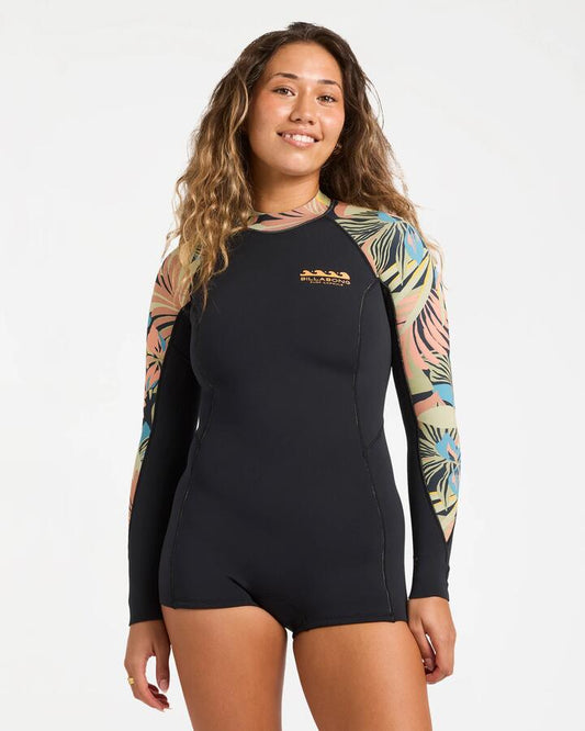 Image of a model wearing Tops. Product name - Billabong Womens 2/2Mm Spring Fever Natural Long Sleeve Springsuit Black Tropical in Black Tropical colour by brand - Billabong