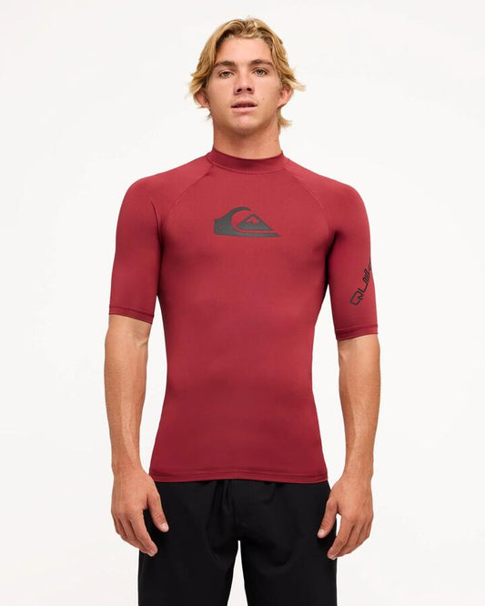 Image of a model wearing Tops. Productname: Quiksilver Mens All Time Short Sleeve Rash Vest Burnt Russet - in Burnt Russet colour by brand - Quiksilver