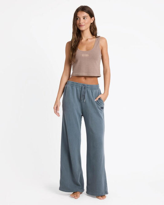 Image of a model wearing Pants. Product name - Roxy Womens Heading Out Trackpants Dark Slate in Dark Slate colour by brand - Roxy