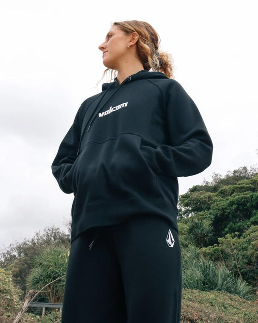 Image of a model wearing Outerwear. Product name - Volcom Womens Get More Pullover Hoodie Black in Black colour by brand - Volcom