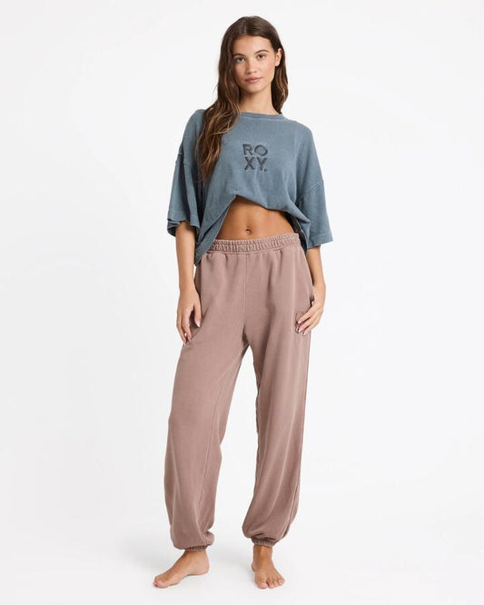 Image of a model wearing Pants. Product name - Roxy Womens Steppin Up Trackpants Mocha in Mocha colour by brand - Roxy