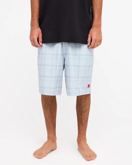 Image of a model wearing Shorts. Product name - Quiksilver Mens Yg Check In Amphibian 21" Hybrid Shorts Quarry Check In in Quarry Check In colour by brand - Quiksilver