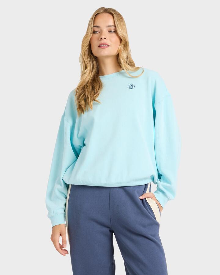 Image of a model wearing Outerwear. Product name - Billabong Womens Sanibel Kendal Pullover Crew Neck Pool Blue in Pool Blue colour by brand - Billabong