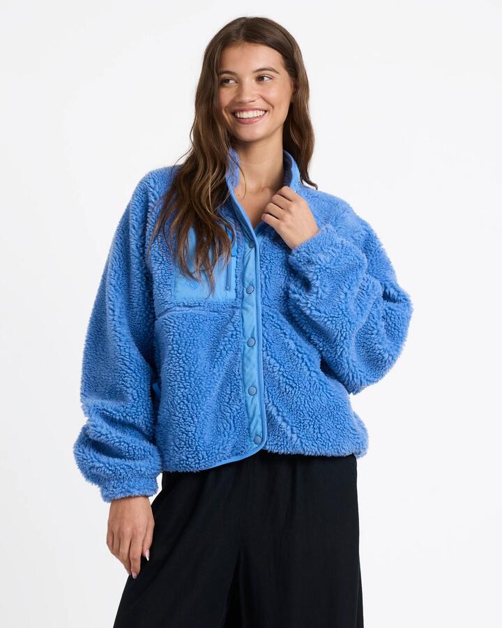 Image of a model wearing Outerwear. Product name - Roxy Womens Free Spirit Fleece Jacket Ashley Blue in Ashley Blue colour by brand - Roxy