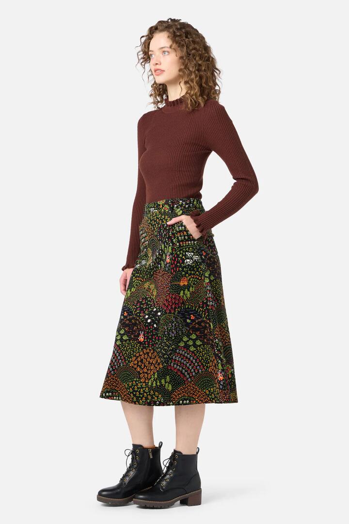 Image of a model wearing Skirts. Productname: Rolling Hills Cord Midi Skirt in Black colour by brand - Princess Highway