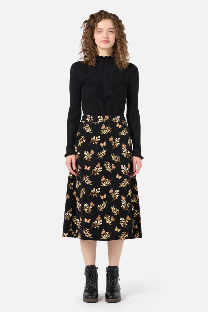 Image of a model wearing Skirts. Productname: Wattle & Butterfly Midi Skirt in Black colour by brand - Princess Highway