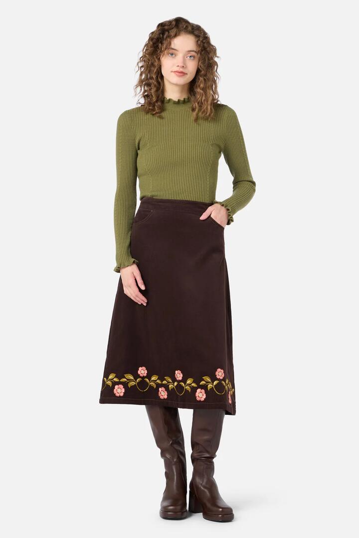 Image of a model wearing Skirts. Productname: Della Embroidered Midi Skirt in Chocolate colour by brand - Princess Highway