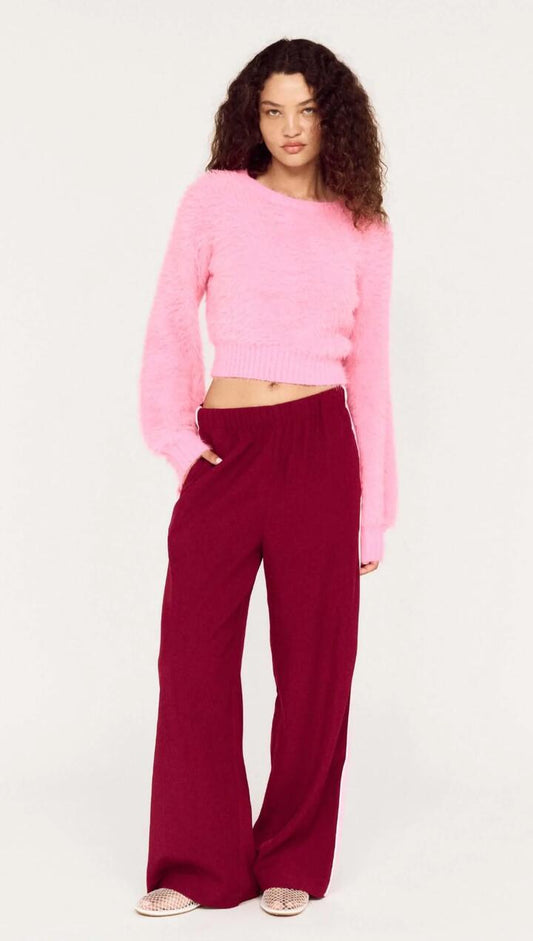 Image of a model wearing Pants. Product name - Side Stripe Wide Leg Jogger Pant in Wine/Pop Pink colour by brand - MINKPINK