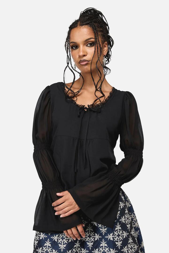 Image of a model wearing Tops. Productname: Joust Peplum Top in Black colour by brand - Black Friday