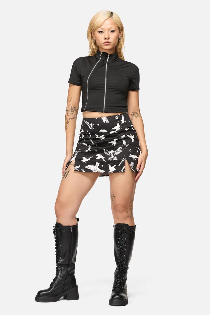 Image of a model wearing Skirts. Product name - Corbeau Print Fitted Mini Skort in Black colour by brand - Black Friday