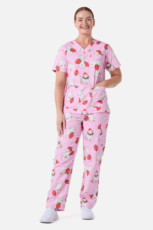 Image of a model wearing Uniforms & Workwear. Productname: Strawberry Cats Scrub Set in Pink colour by brand - Scrubs With Love