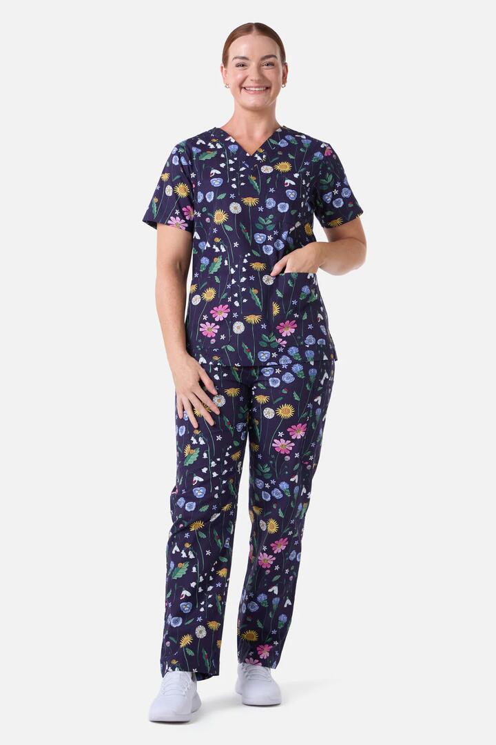 Image of a model wearing Uniforms & Workwear. Productname: Spring Garden Scrub Set in Indigo colour by brand - Scrubs With Love