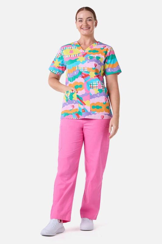 Image of a model wearing Uniforms & Workwear. Productname: Idolize Top & Pant Scrub Set in Pink colour by brand - Scrubs With Love