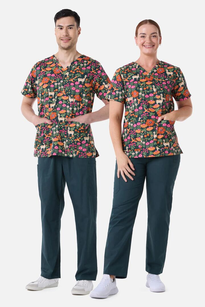 Image of a model wearing Uniforms & Workwear. Product name - LlamaBird Top & Pant Scrub Set in Green colour by brand - Scrubs With Love