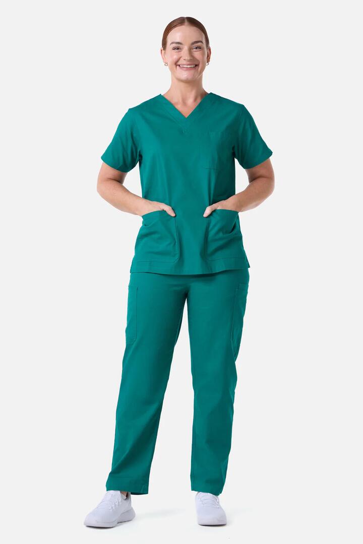Image of a model wearing Uniforms & Workwear. Product name - Scrubswithlove Pine Scrub Set in Pine colour by brand - Scrubs With Love