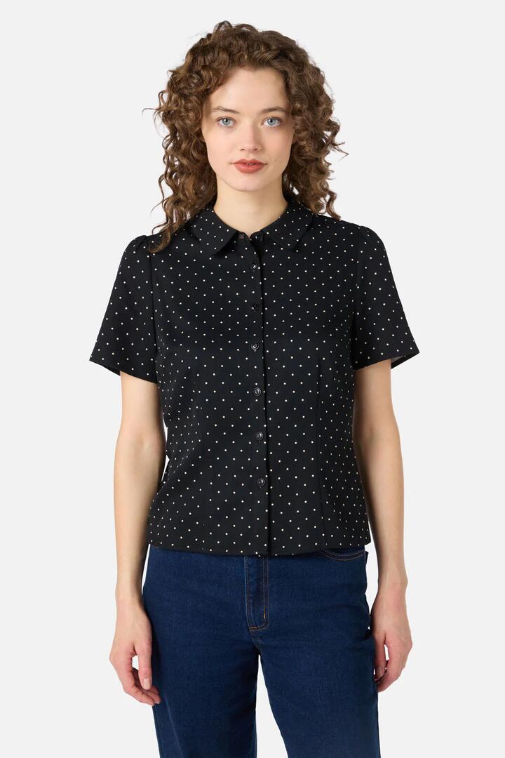 Image of a model wearing Tops. Productname: Dolly Spot Short Sleeve Blouse in Black colour by brand - Princess Highway