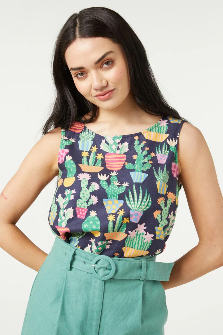 Image of a model wearing Tops. Productname: Cacti Shell Top in Navy colour by brand - Princess Highway