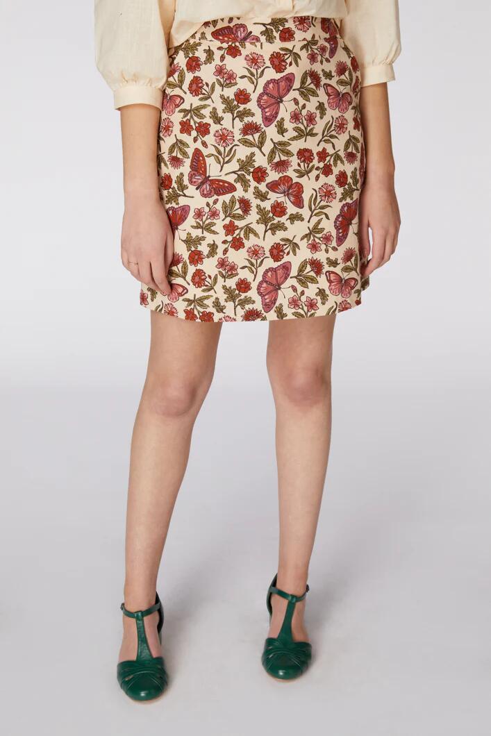 Image of a model wearing Skirts. Productname: Babette Butterfly Skirt in Cream colour by brand - Princess Highway