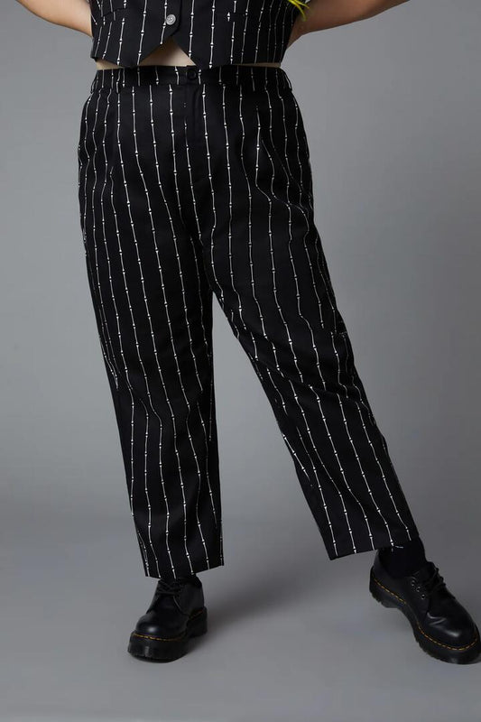 Image of a model wearing Pants. Productname: Curve Funny Bone Pant in Black colour by brand - Black Friday