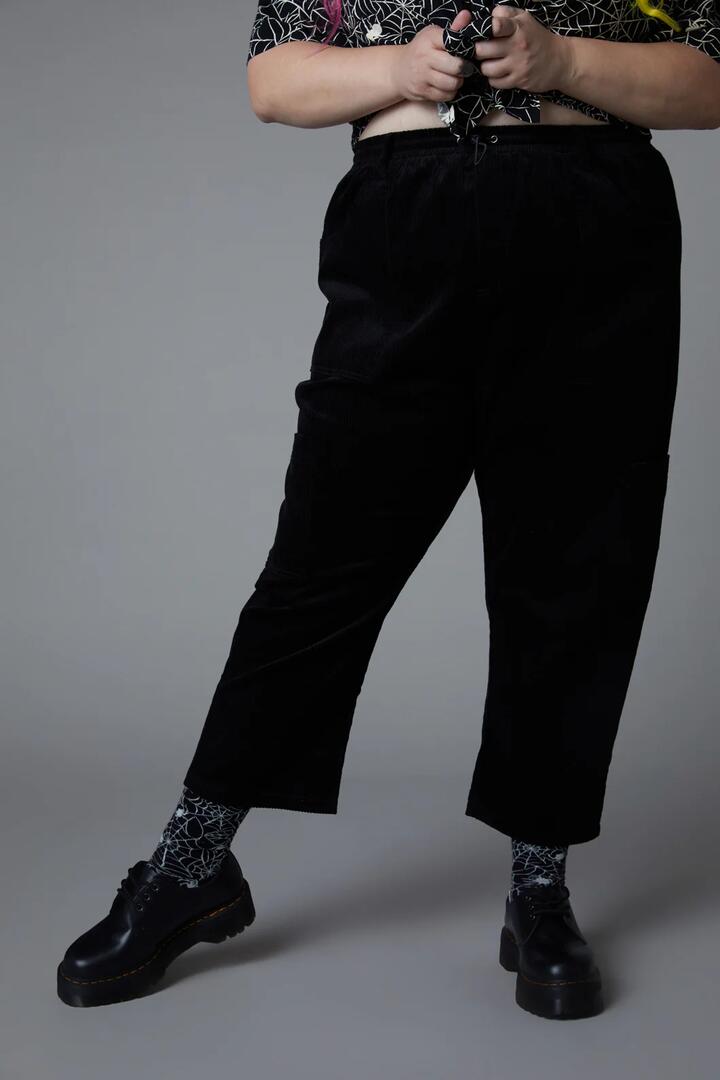 Image of a model wearing Pants. Productname: Curve Skulduggery Cargo Pant in Black colour by brand - Black Friday