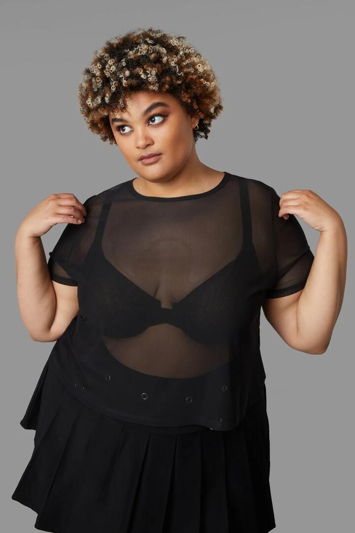 Image of a model wearing Tops. Productname: Curve Entity Mesh Top in Black colour by brand - Black Friday