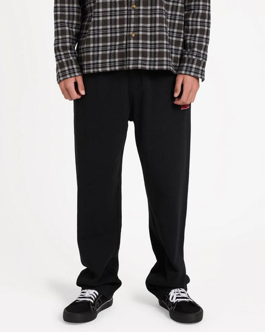 Image of a model wearing Pants. Product name - Billabong Mens Immortal Blast Track Pants Black in Black colour by brand - Billabong