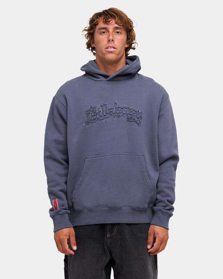Image of a model wearing Outerwear. Product name - Billabong Mens Immortal Distress Pullover Hoodie Dirt Navy in Dirt Navy colour by brand - Billabong