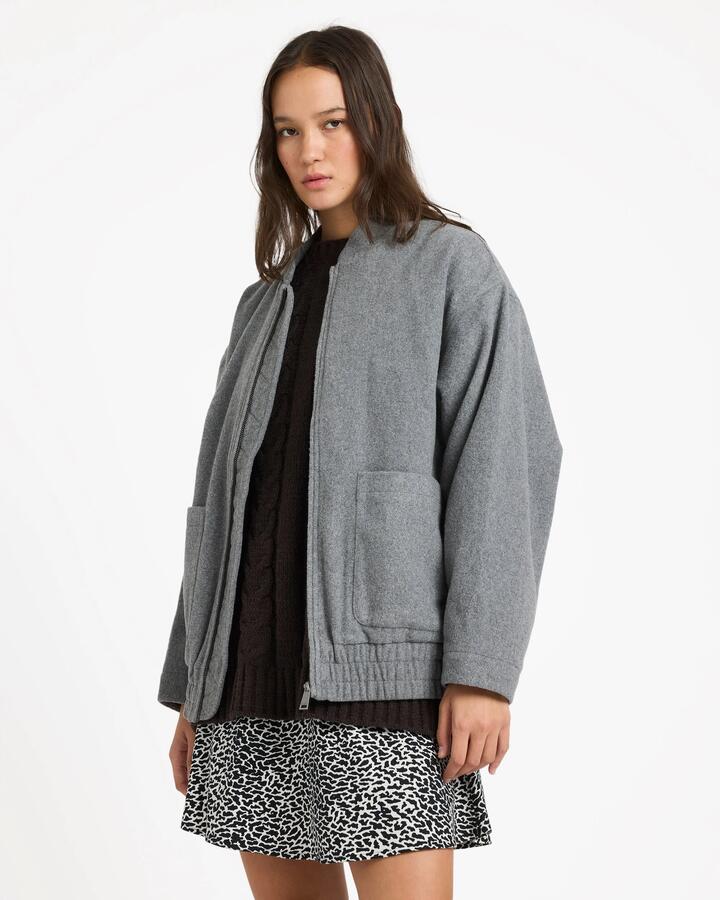 Image of a model wearing Outerwear. Product name - Volcom Womens Shes Da Bomb Bomber Jacket Heather Grey in Heather Grey colour by brand - Volcom