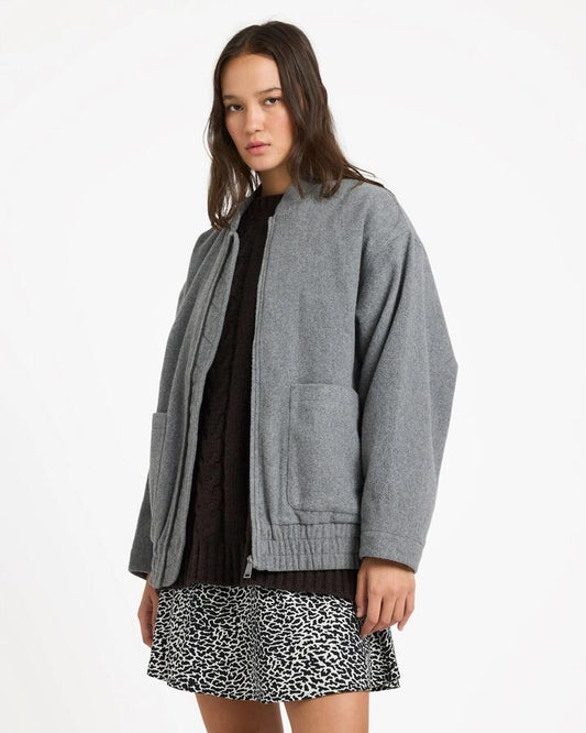 Image of a model wearing Outerwear. Product name - Volcom Womens Shes Da Bomb Bomber Jacket Heather Grey in Heather Grey colour by brand - Volcom