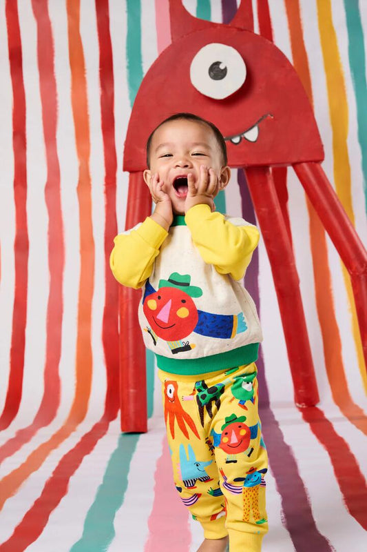 Image of a model wearing Outerwear. Product name - Happy Monster Baby Sweater in Multi colour by brand - Gorman