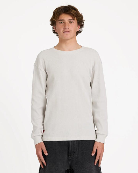 Image of a model wearing Tops. Product name - Billabong Mens Immortal Waffle Long Sleeve T-Shirt Fog in Fog colour by brand - Billabong