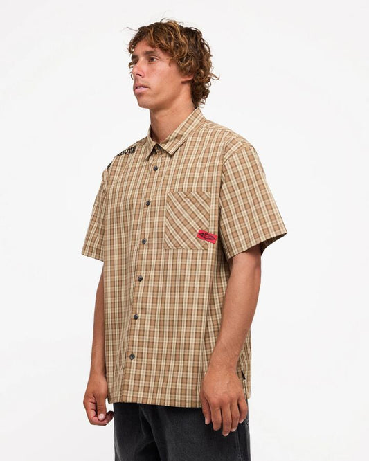 Image of a model wearing Tops. Product name - Billabong Mens Immortal Mogul Short Sleeve Shirt Gravel in Gravel colour by brand - Billabong