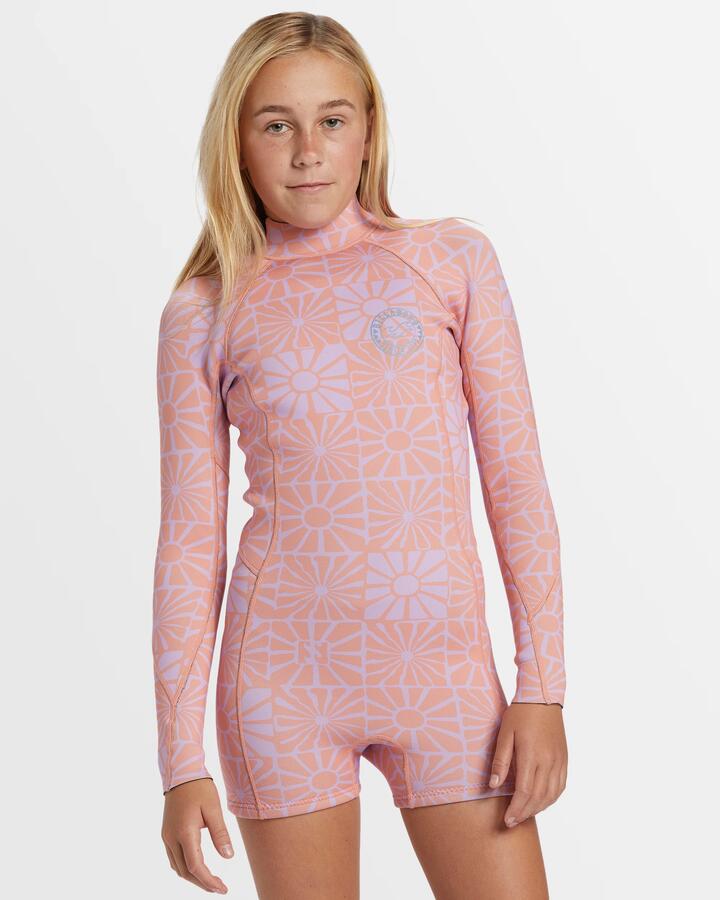 Image of a model wearing Tops. Product name - Billabong Girls 6-14 Spring Fever Natural Long Sleeve Springsuit Peach Paradise in Peach Paradise colour by brand - Billabong