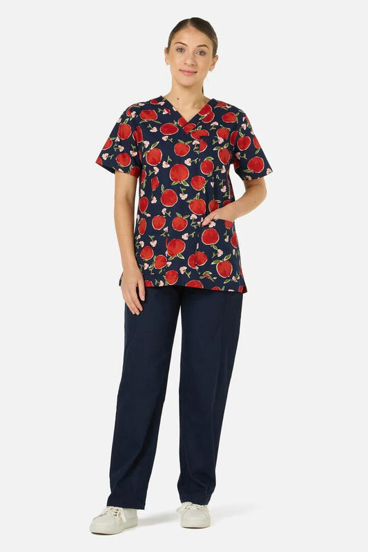 Image of a model wearing Uniforms & Workwear. Product name - Sweet Apple top&pant scrub set in Navy colour by brand - Scrubs With Love
