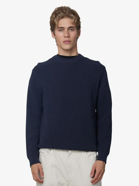 Image of a model wearing Outerwear. Productname: Article One Rib Knit Sweater in Navy colour by brand - Article One