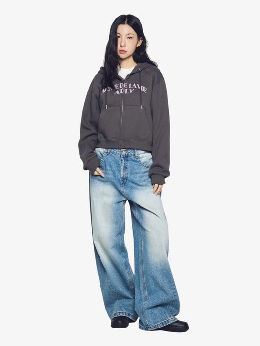 Image of a model wearing Outerwear. Productname: ADLV Women's Arch Shaped Logo Hoodie Zip-Up ONE SIZE Charcoal in Charcoal colour by brand - ADLV