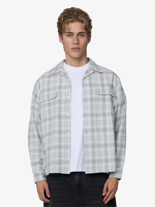 Image of a model wearing Outerwear. Productname: Article One Mavis Midweight Check Overshirt in Grey Plaid colour by brand - Article One