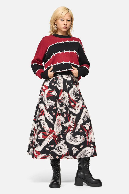 Image of a model wearing Skirts. Productname: Louve Print Pleated Midi Skirt in Black colour by brand - Black Friday