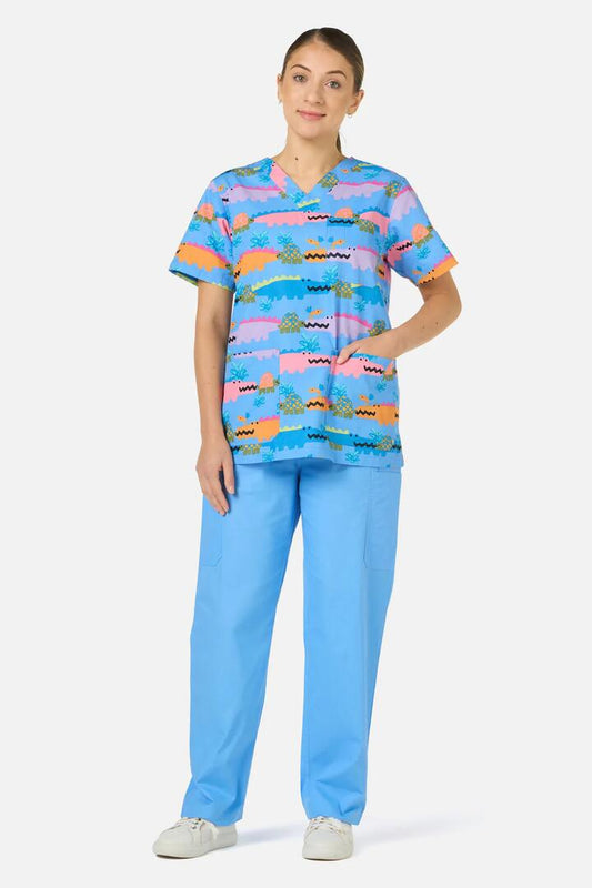 Image of a model wearing Uniforms & Workwear. Product name - Croc Snap Top & Pant Scrub Set in Blue colour by brand - Gorman