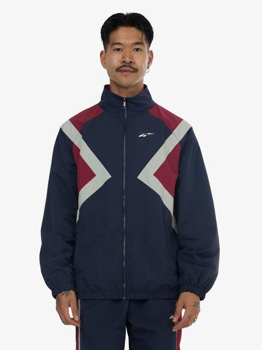 Image of Coats & Jackets. Productname: Reebok Vector Woven Track Jacket in Dark Indigo/Heritage Red colour by brand - Reebok