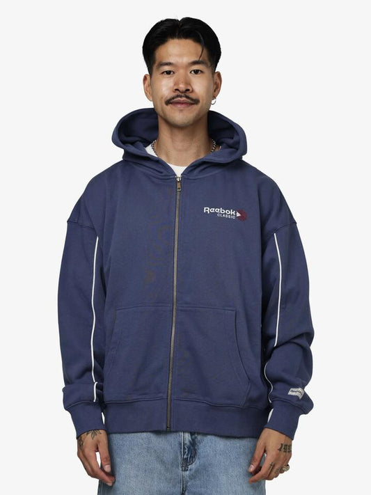 Image of a model wearing Outerwear. Productname: Reebok Classics Zip Through Hoodie in Legacy Blue colour by brand - Reebok