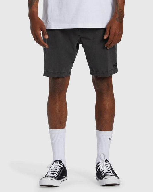 Image of a model wearing Shorts. Product name - Billabong Mens Crossfire Wave Washed 18" Hybrid Shorts Washed Black in Washed Black colour by brand - Billabong