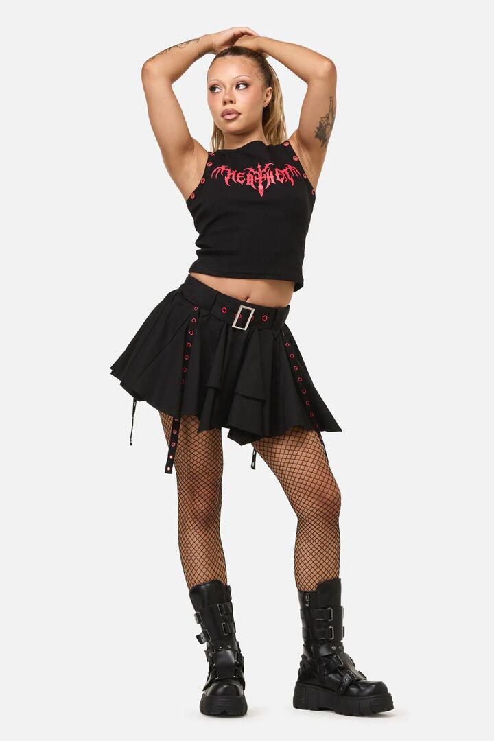 Image of a model wearing Skirts. Productname: Heathen Goth Eyelet Skort in Black colour by brand - Dangerfield