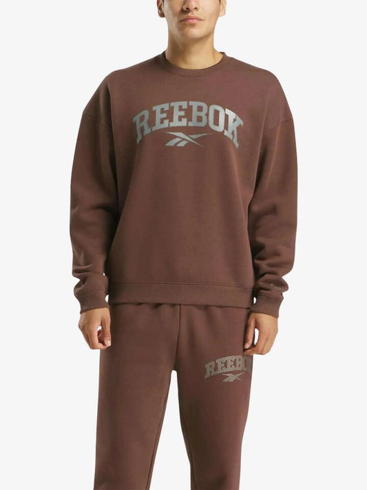 Image of a model wearing Outerwear. Productname: Reebok Curtis Varsity Sweatshirt in Campus Brown colour by brand - Reebok
