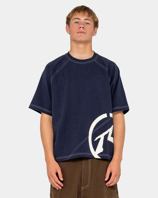 Image of a model wearing Tops. Product name - Rusty Mens Pablo Short Sleeve Heavy T-Shirt Navy Blue in Navy Blue colour by brand - Rusty