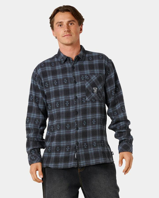 Image of a model wearing Tops. Product name - Rip Curl Mens Liquid Trips Flannel Long Sleeve Shirt Washed Black in Washed Black colour by brand - Rip Curl